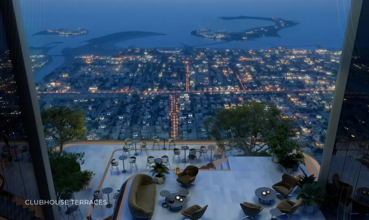 Clubhouse terrace at night overlooking the lights of Dubai at Ellington Berkeley Tower