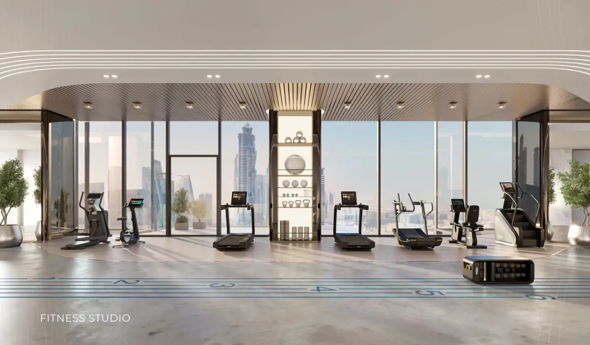 Fitness studio with treadmills facing the Downtown Dubai skyline at Ellington Berkeley Tower