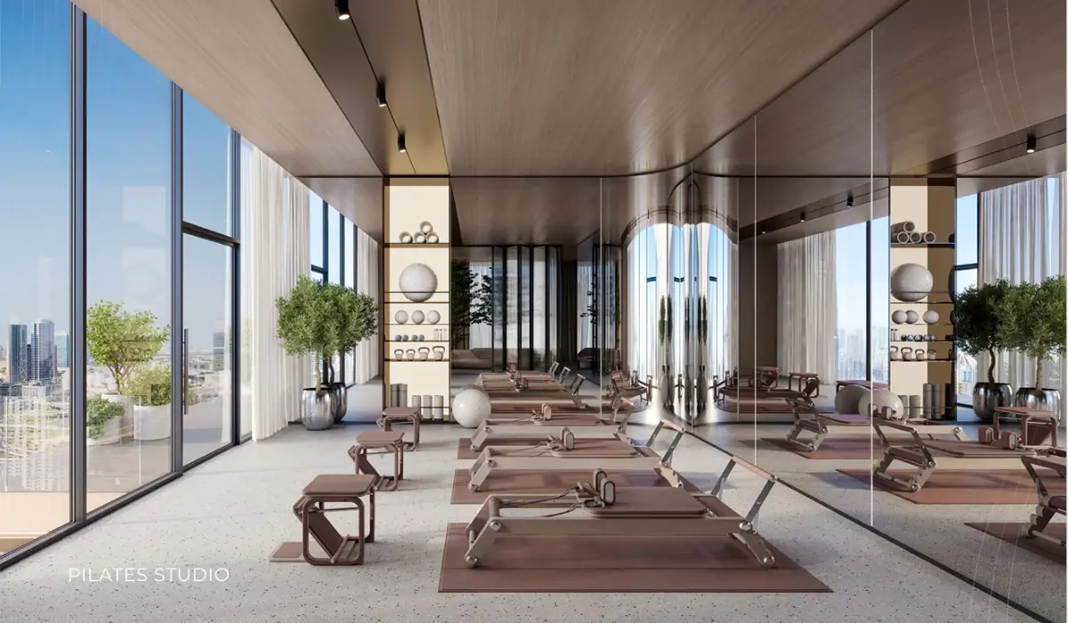 Pilates studio with reformer machines and timber ceiling at Ellington Berkeley Tower